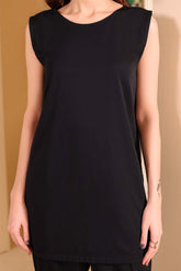 A black sleeveless crepe fabric inner worn by a model with a boat neckline and side slits.