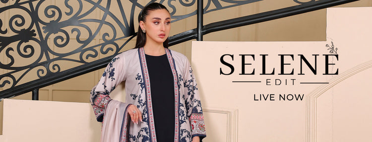 Woman in a patterned outfit standing in front of a decorative wall with 'SELENE EDIT' branding.